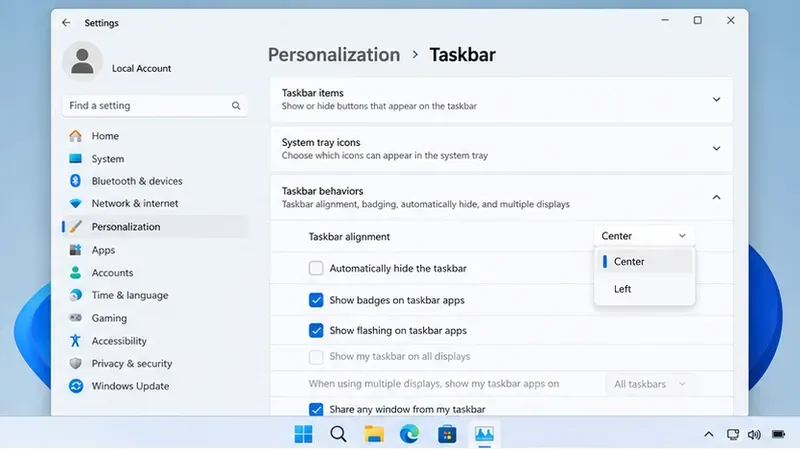 Windowsのタスクバー設定画面では、タスクバーの動作と、中央揃えまたは左揃えのオプションが表示されます。